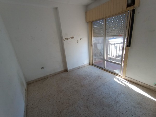 Venta lote con dos deptos zona costanera.